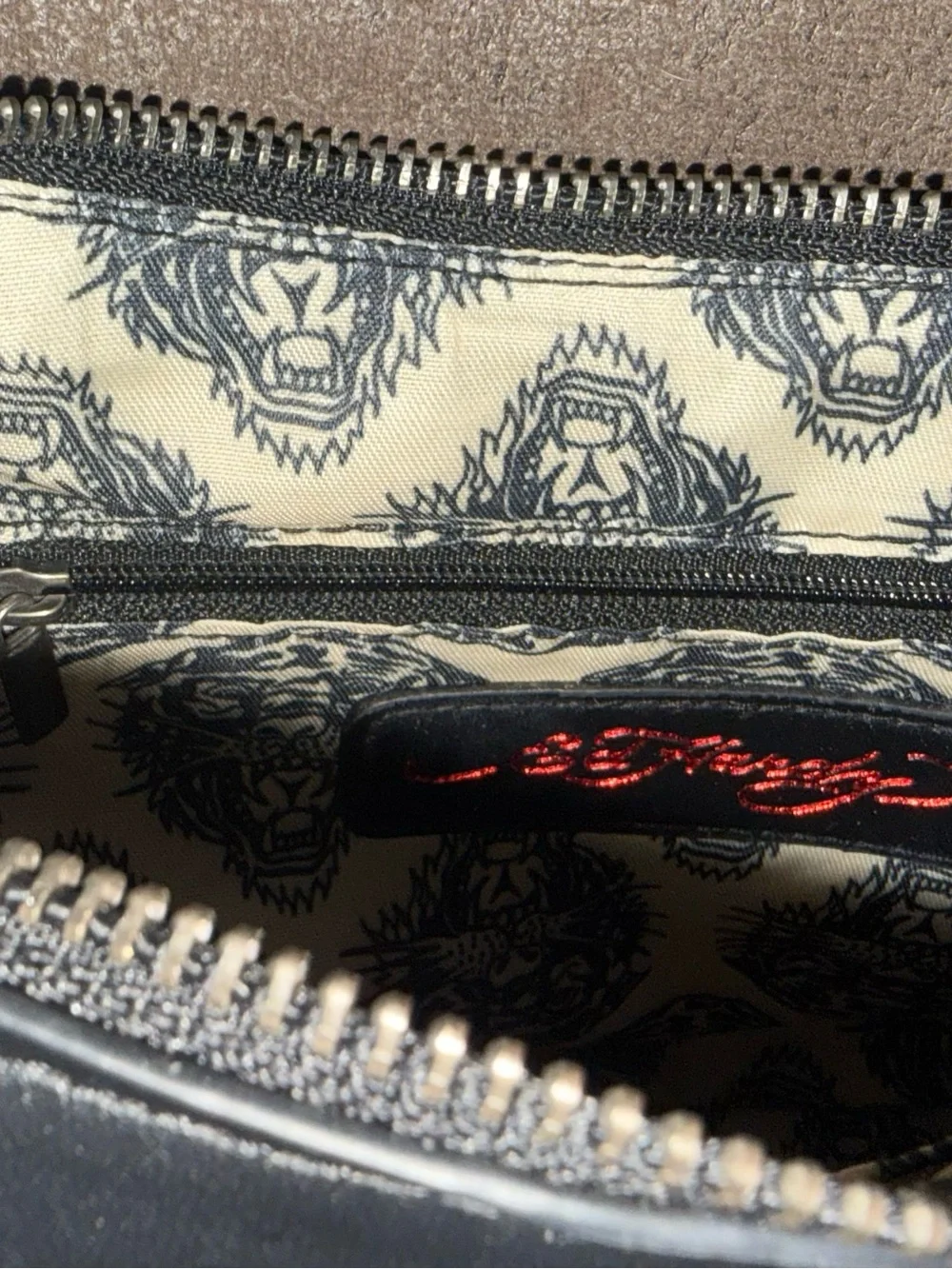 Signature Ed Hardy tattoo print Shoulder Bag with Skull, Rose & Pink accents.